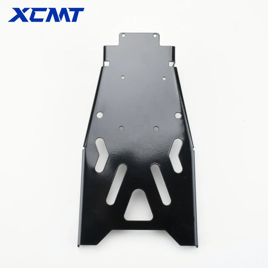 A black metal protective skid plate or chassis brace with pre-drilled mounting holes, shown on a white background with the XCMT brand logo in the top left corner.