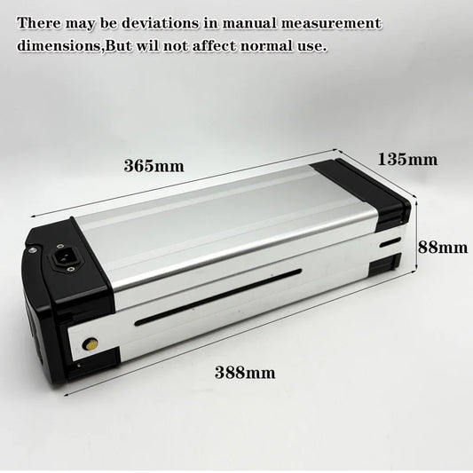A silver and black rectangular electronic device shown on a light gray background with overlaid dimension labels and text noting manual measurement deviations.