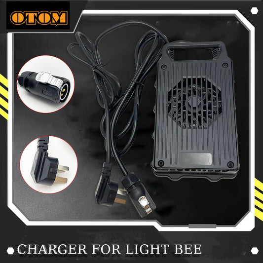 Black OTOM brand charger for Light Bee, featuring a ribbed metal casing with a built-in cooling fan, a long black power cable, and two circular inset images showing the connector plugs.
