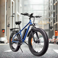 Blue electric bike on a city street with buildings in the background