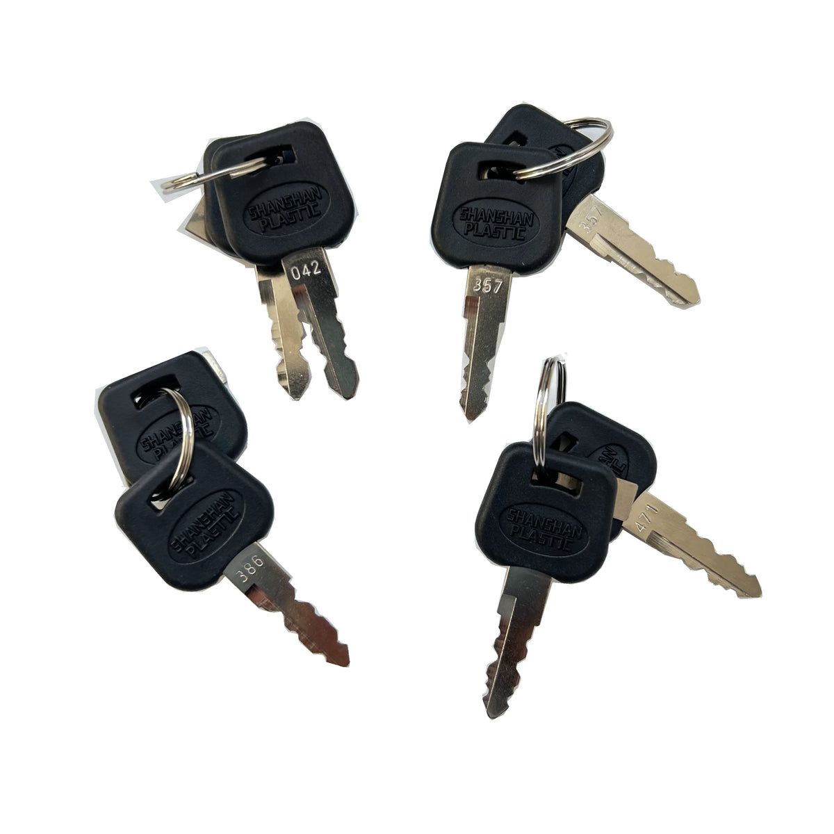 Four black plastic Master Lock key fobs with metal keys attached, arranged on a plain white background.