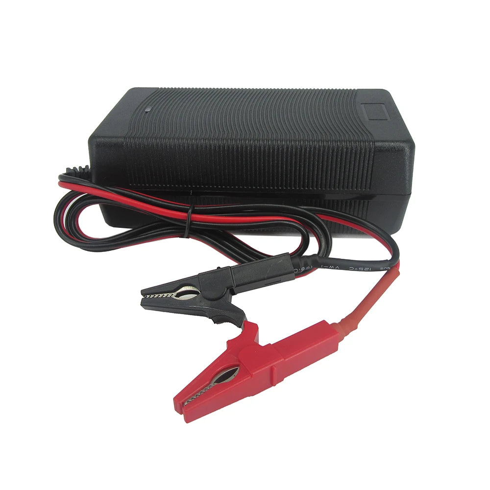 Black battery charger with red clamps on a white background