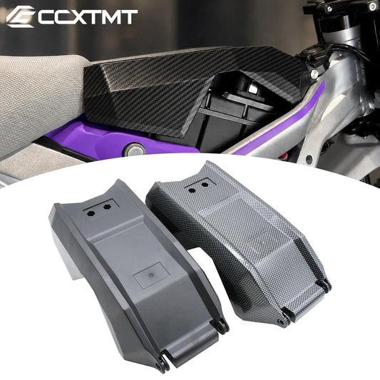 Two motorcycle fuel tank covers, one in matte black and one in carbon fiber weave, shown on a white background with a motorcycle seat area in the background. The brand logo 'CCXTMT' is visible in the top left corner.