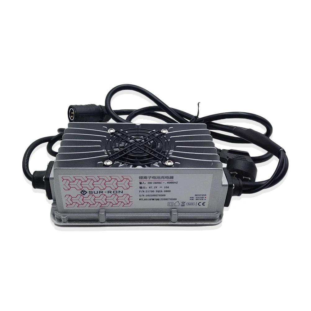 A gray and black electronic power supply unit with a cooling fan on top, attached black cables, and a printed label on the side, photographed on a white background.