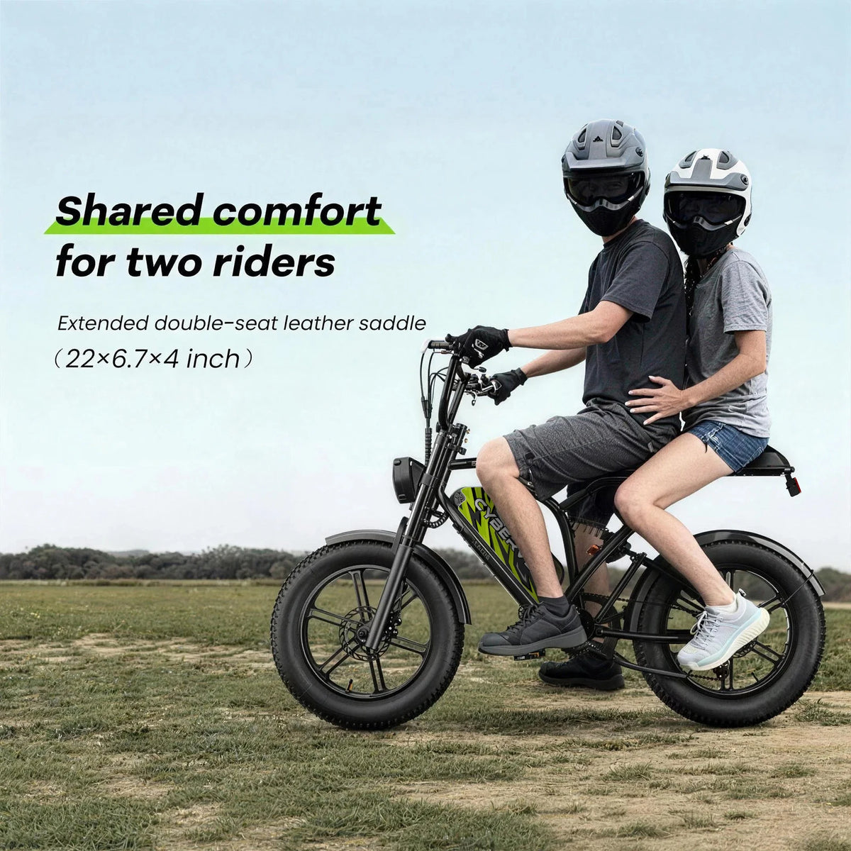 Two people riding a two-seater electric bike in an open field with text about shared comfort and extended double-seat leather saddle.