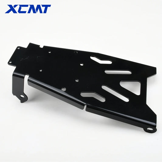 A black metal bracket or frame component with pre-drilled mounting holes and cutouts, shown on a white background with the XCMT logo in the top-left corner.