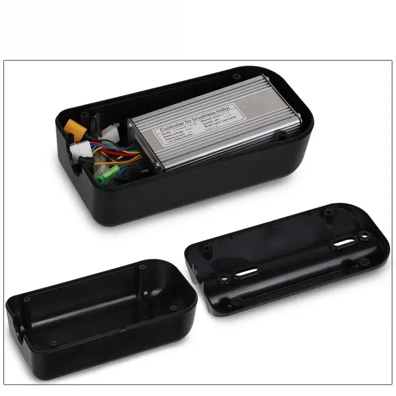 A black electronic control box shown open, with a silver control module inside and a wiring harness visible. The separate black cover pieces are displayed below on a white background.