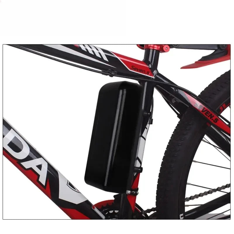A black rectangular battery pack mounted on the rear triangle of a red, black, and white bicycle frame.