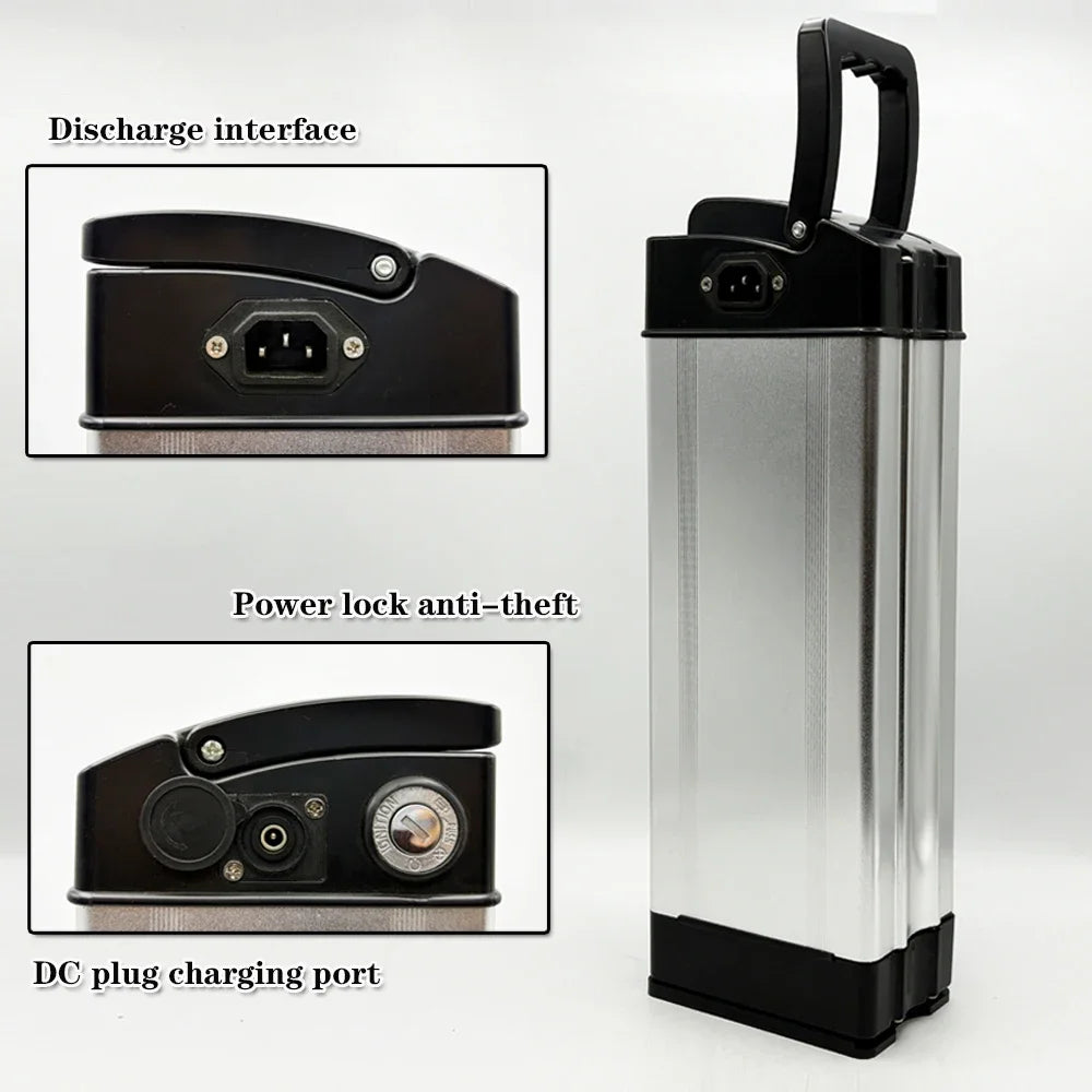 A tall rectangular portable battery with a brushed silver body and black top and bottom sections, shown on a light gray background. The image includes two inset close-ups labeled 'Discharge interface,' 'Power lock anti-theft,' and 'DC plug charging port,' plus a black carrying handle on top.