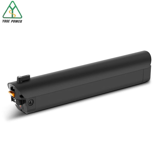 A black metal cylindrical rod with a threaded male end, photographed diagonally on a light gray studio background.