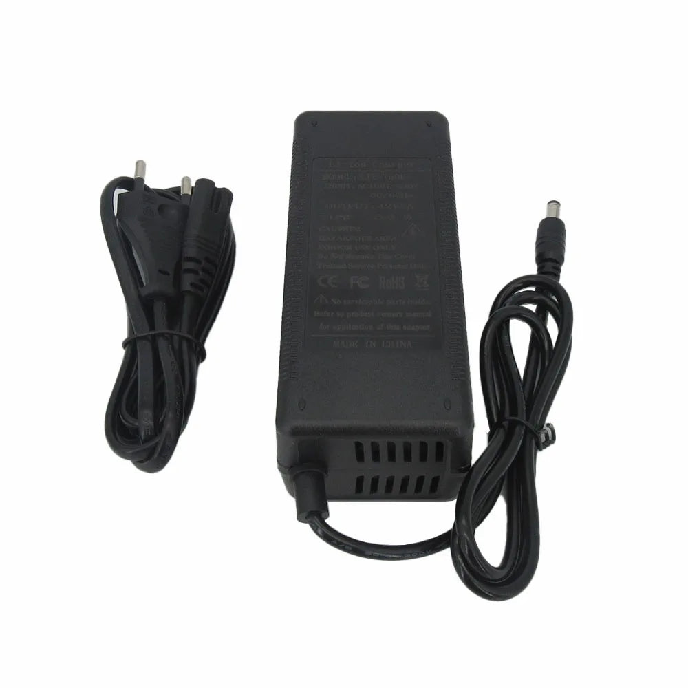 Black AC adapter power supply with a coiled power cord on the left and a DC barrel connector cable on the right, shown on a plain white background.