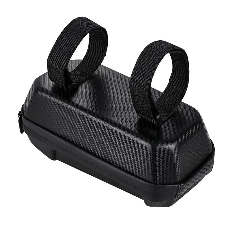A black carbon fiber textured hard case with two black webbing loops on top, shown on a plain white background.