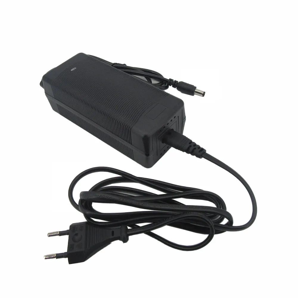 A black plastic power adapter with a coiled black cable, featuring a European two-pin plug on one end and a barrel connector on the other, shown against a plain white background.