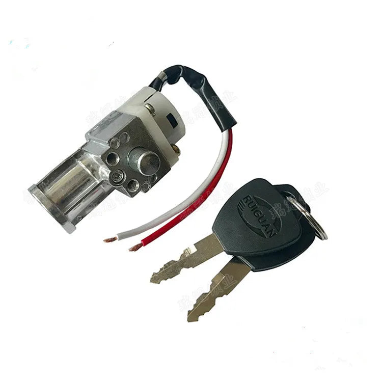 A small electric lock cylinder lockpick with attached red and white wires and two keys, photographed on a plain white background.