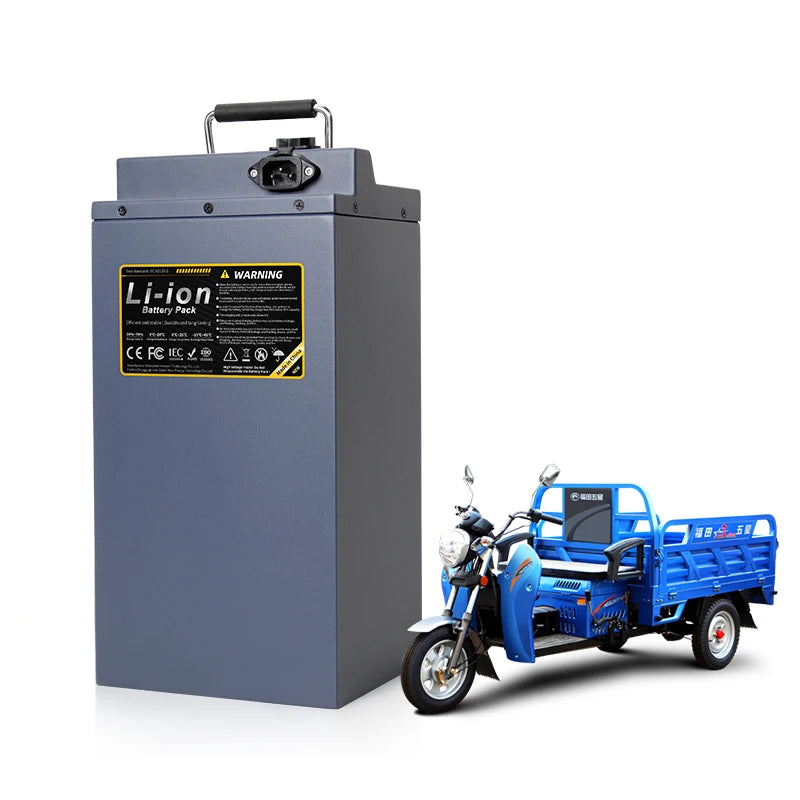 Large lithium-ion battery pack next to a blue electric tricycle on a white background