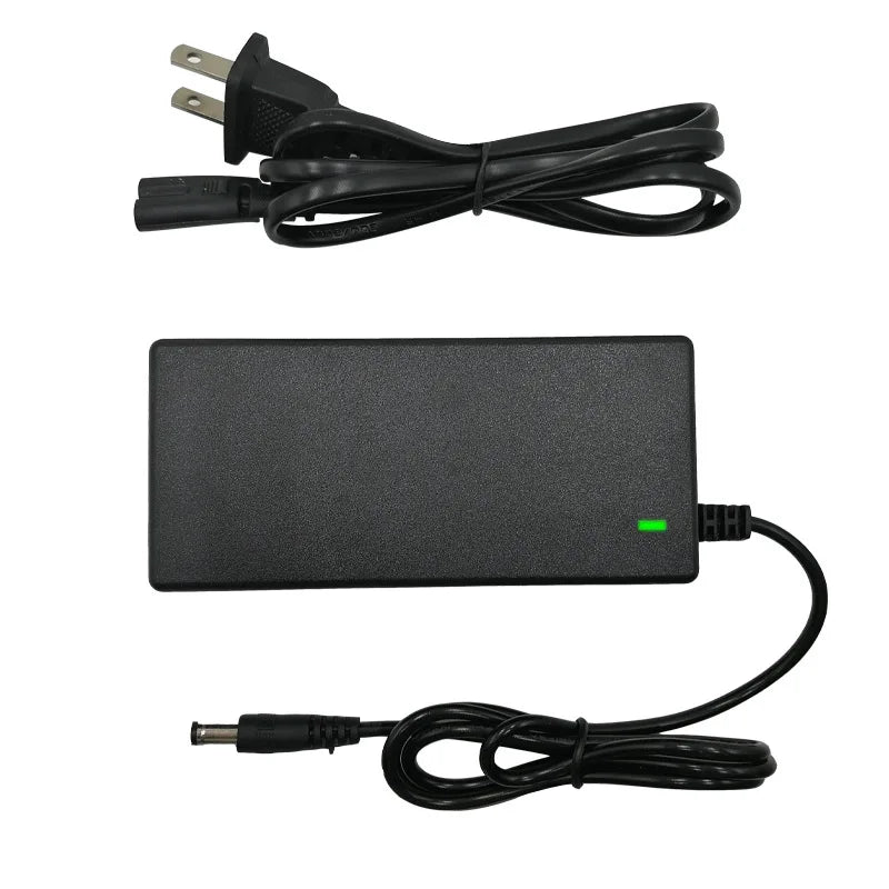 Black power adapter with plug and cable on a white background