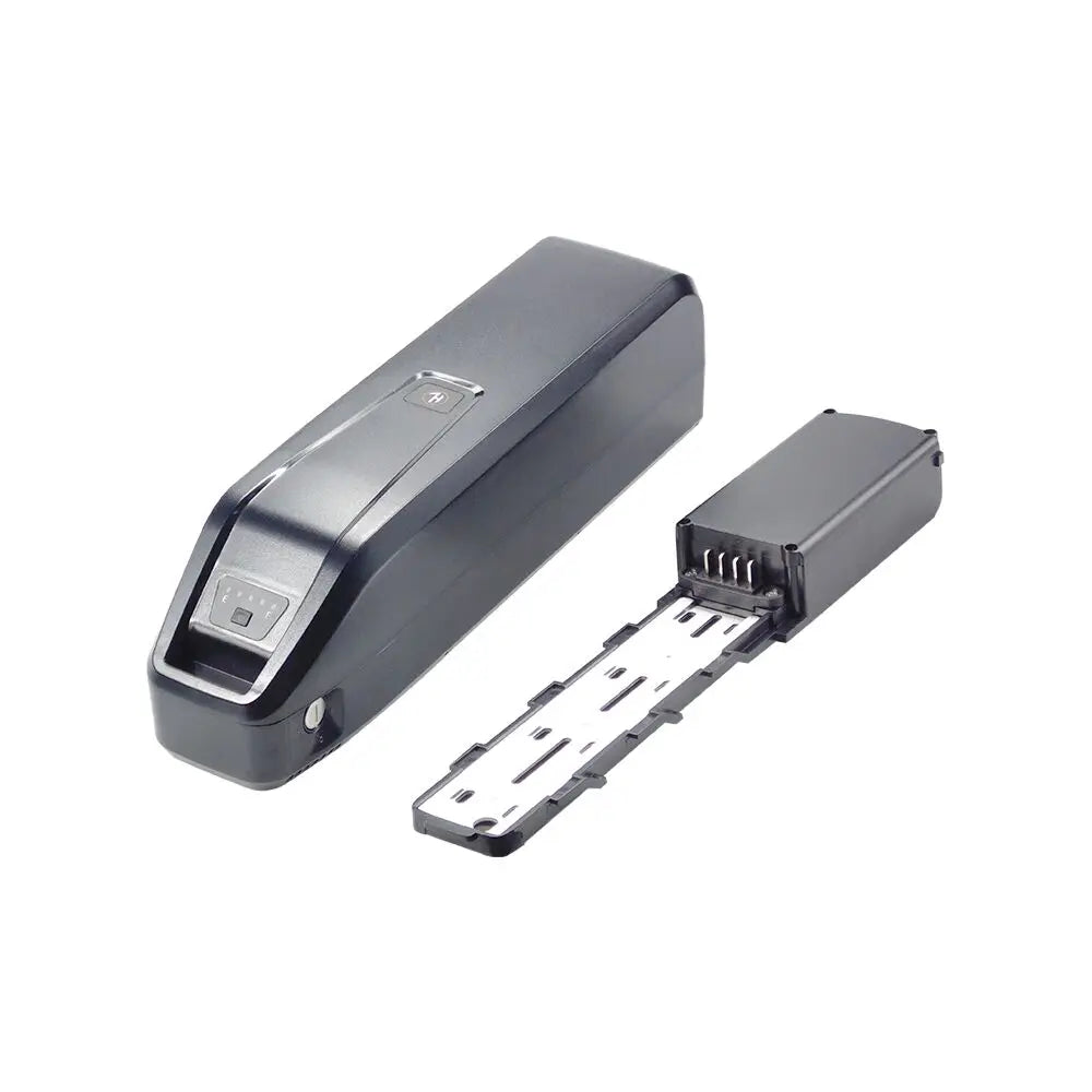 A black electronic device with a sliding cover, shown alongside its detached metal contact plate on a plain white background.