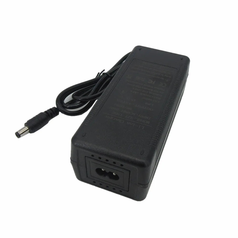 A black DC power adapter with a coiled cable and a barrel connector, photographed on a plain white background.