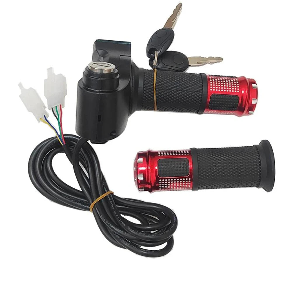 A motorcycle or bicycle handlebar ignition switch assembly with a black handlebar clamp, black textured grip, red metallic end cap, attached keys, and a coiled black cable with white connector plugs, shown on a white background.
