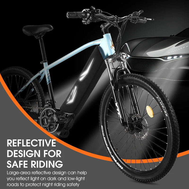 A light blue and black electric mountain bike shown at an angle on a dark studio background with promotional text about reflective design for safe riding.