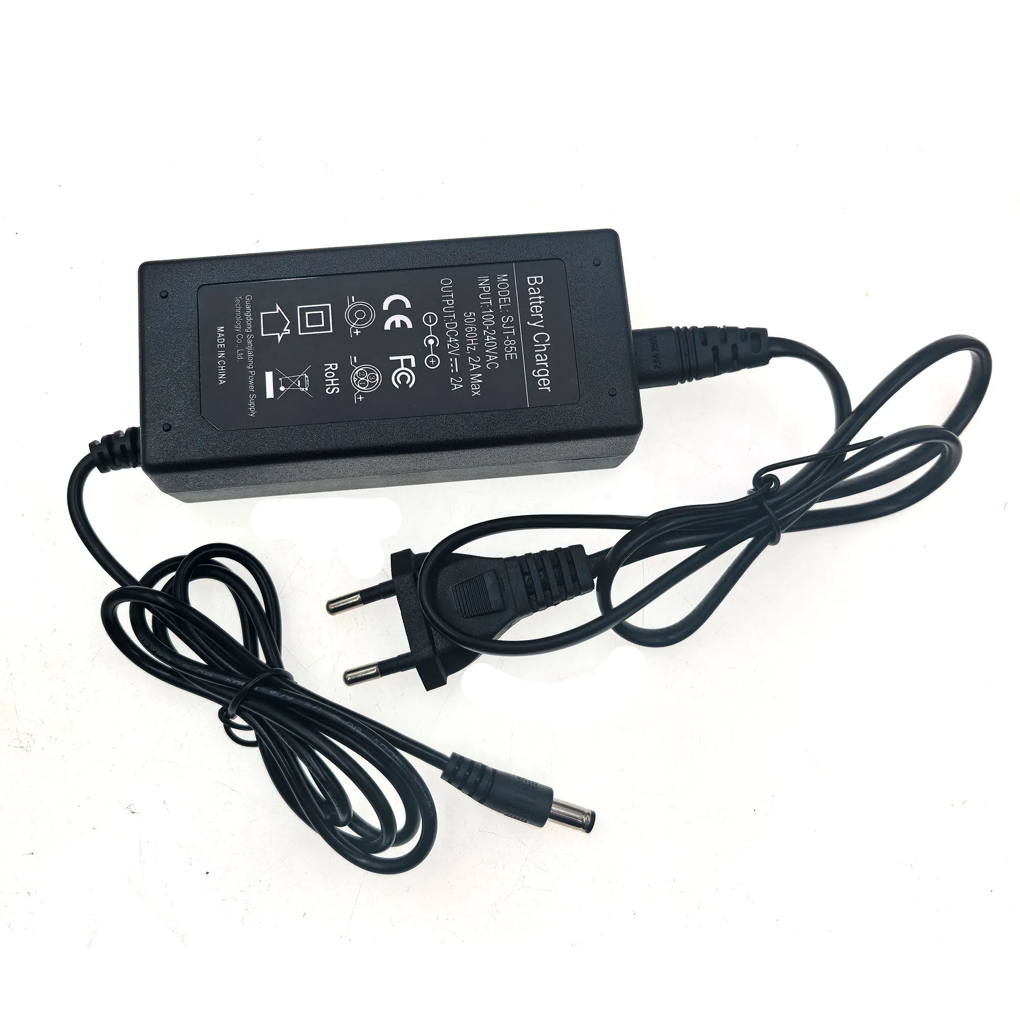 A black battery charger power adapter with a coiled power cord, a two-pin plug, and a barrel connector, shown on a white background.