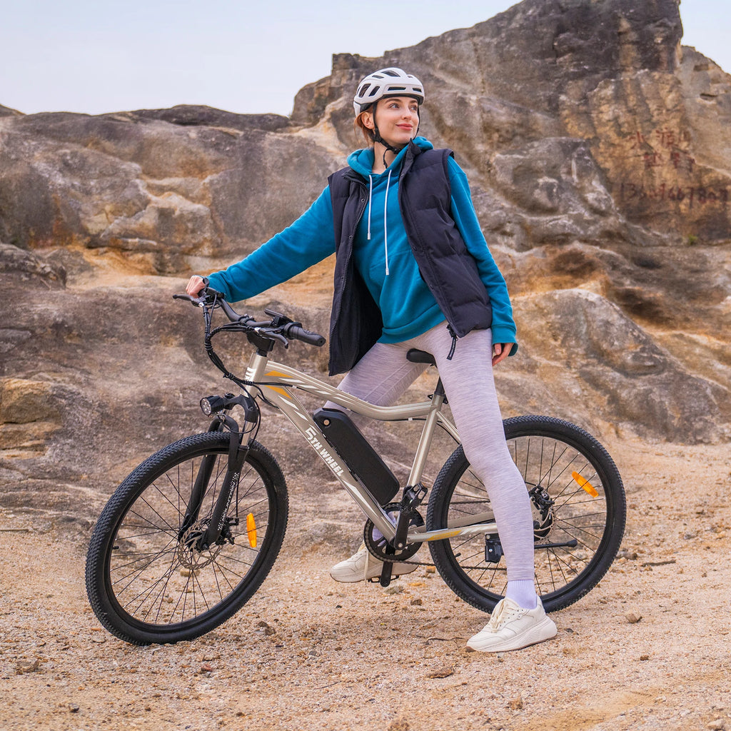 Person with a bicycle on a rocky trail