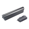 A black cylindrical electronic device shown with its matching power adapter on a plain white background.