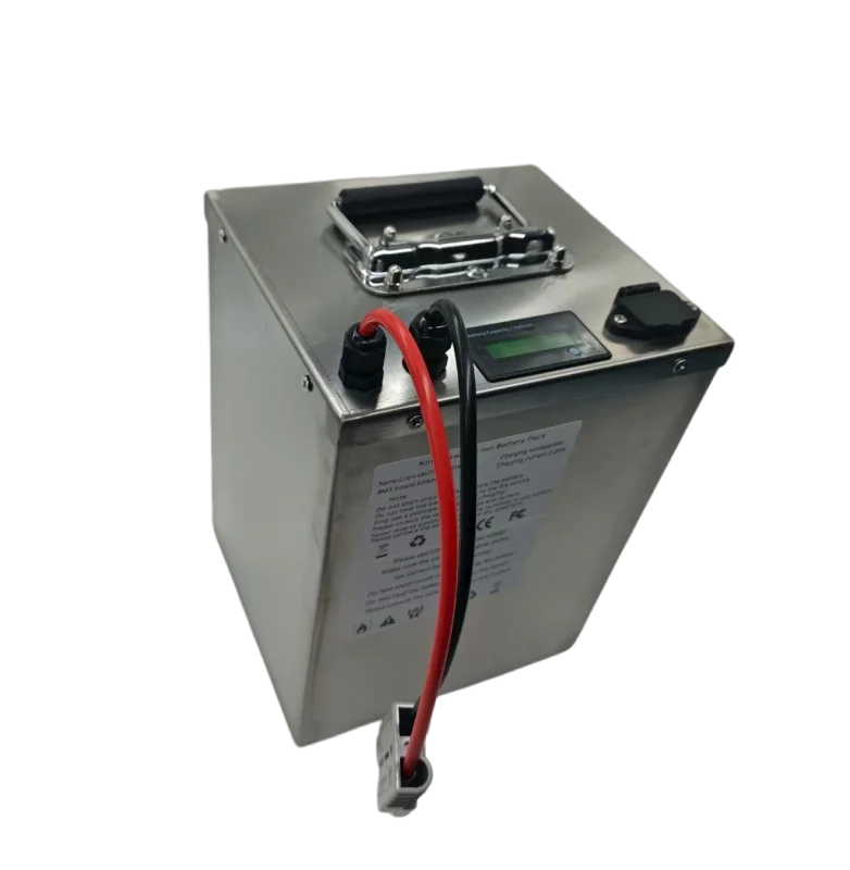 A rectangular silver metal battery with a top handle, a small digital display, a black terminal cap, and red and black cable leads, shown on a plain white background.