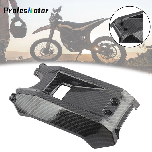 Carbon fiber motorcycle part with a blurred background of a rider and motorcycle.