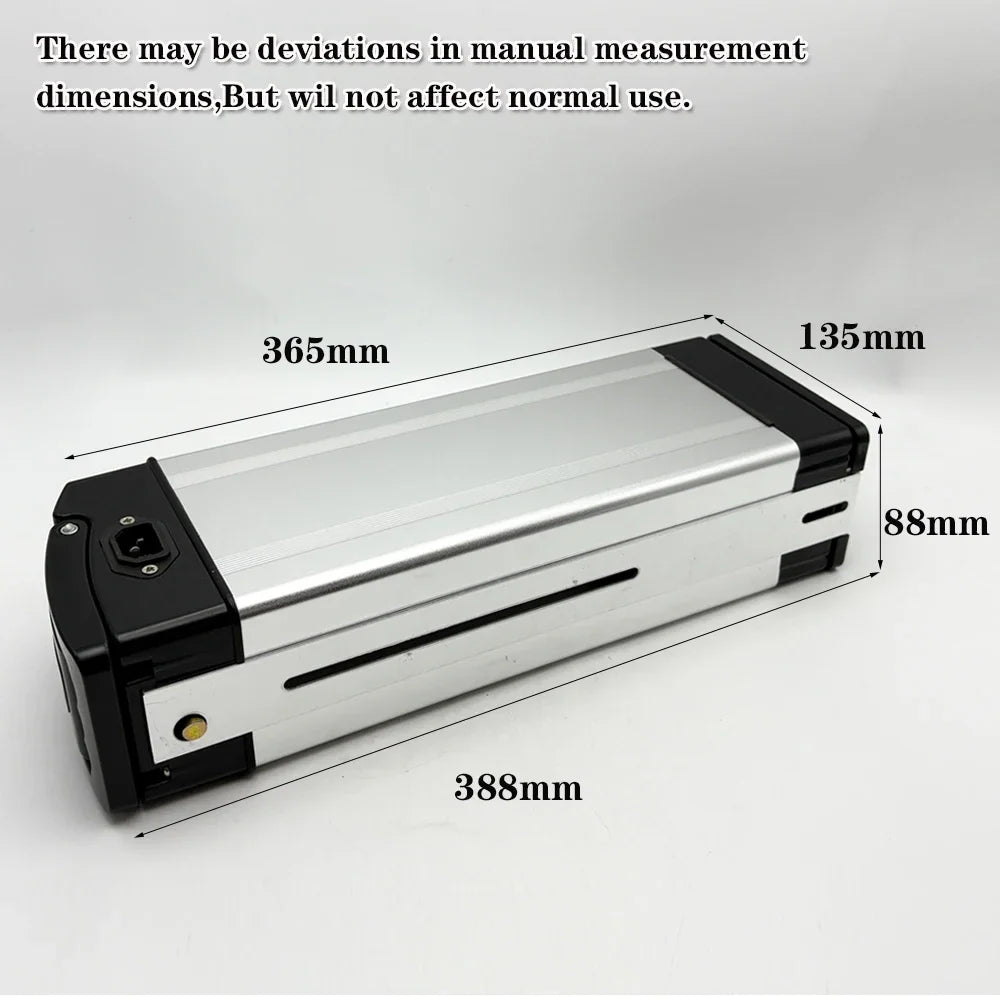 A silver and black rectangular electronic device shown on a light gray background with overlaid dimension labels and text noting manual measurement deviations.
