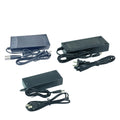 Three black power adapters with attached cables shown on a plain white background.