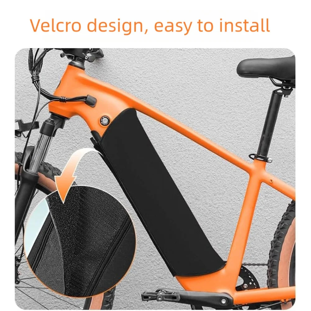 Orange bicycle with a black bag attached using a velcro design on a gray background.