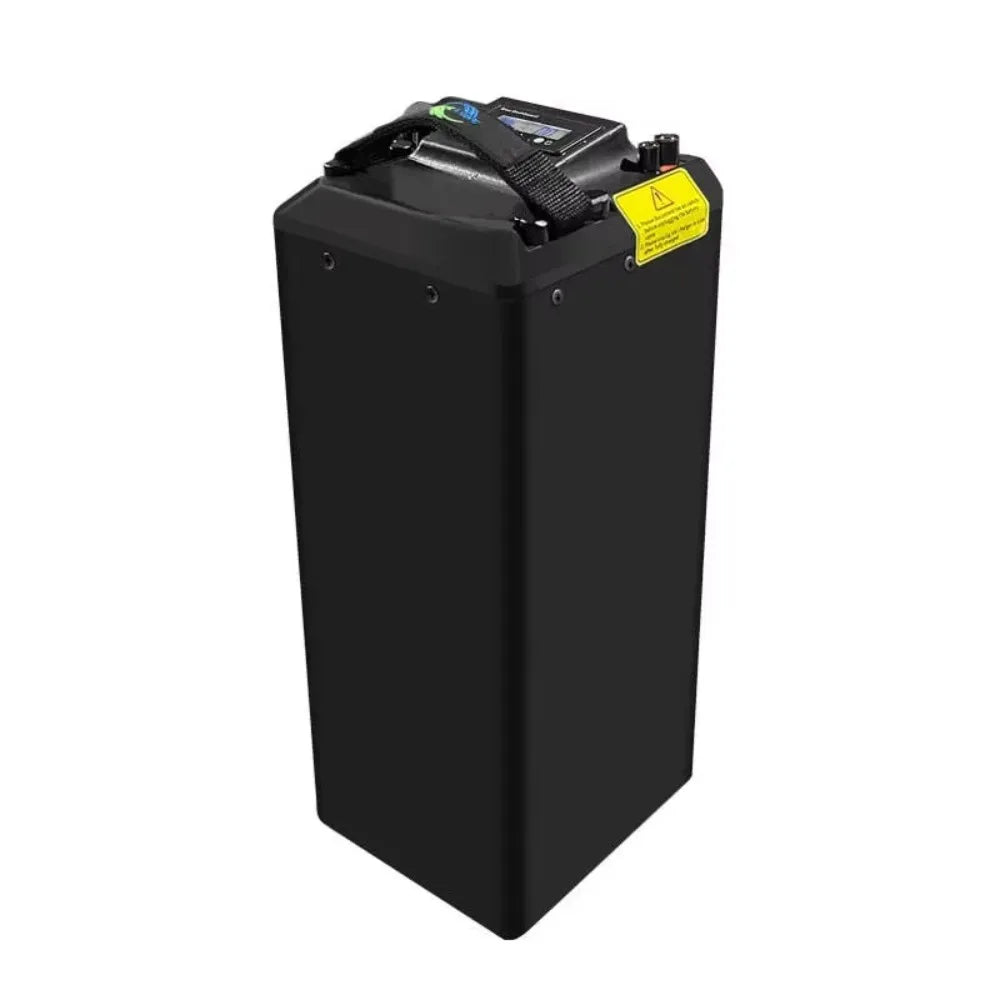 A tall, rectangular black battery pack with a top handle, a small digital display, and a yellow warning label, shown on a plain white background.